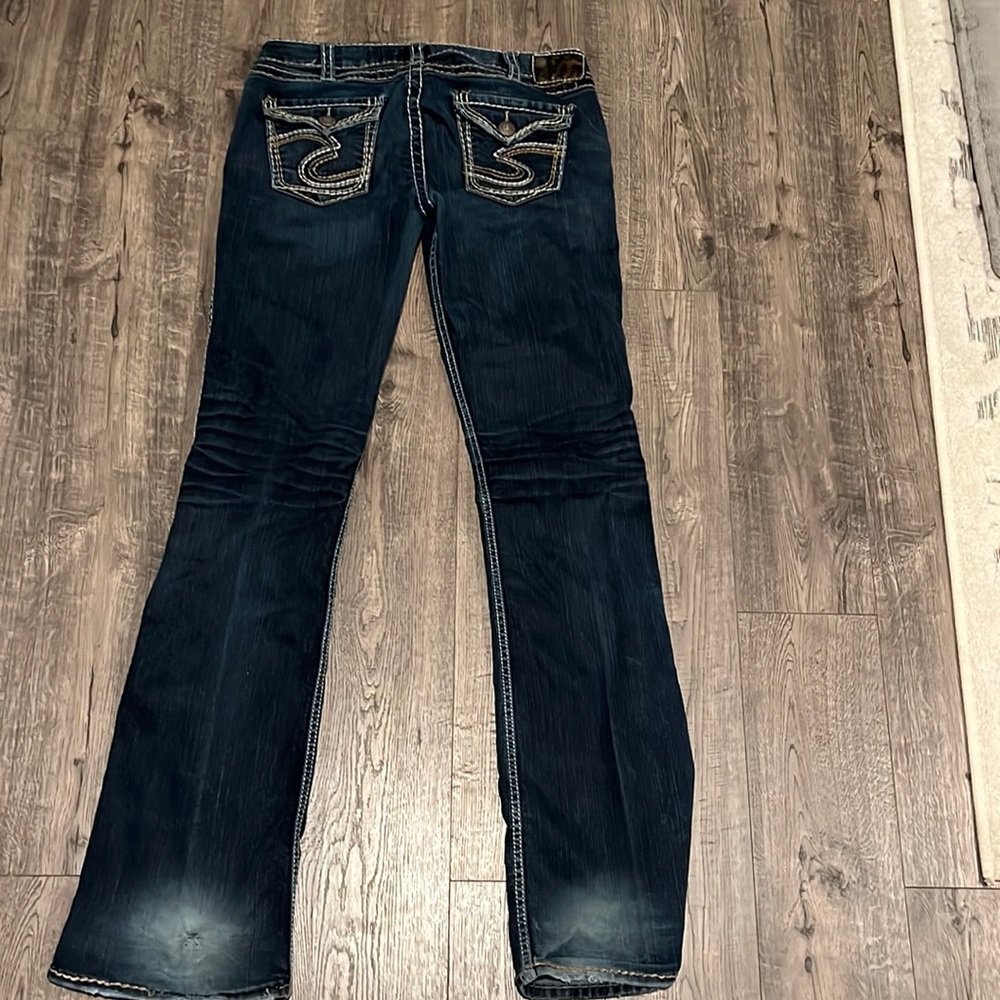 Silver bootcut jeans. Size size 31/37L